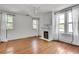 Inviting bedroom showcasing a classic fireplace, hardwood floors, and white curtains, offering a cozy atmosphere at 1157 Alta Ne Ave, Atlanta, GA 30307
