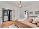 Bedroom featuring hardwood floors, a closet, and natural light, creating a relaxing retreat at 1157 Alta Ne Ave, Atlanta, GA 30307