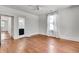 Bedroom with wood floors, neutral walls, ceiling fan, and bright window light at 1157 Alta Ne Ave, Atlanta, GA 30307