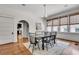 Dining room showcasing hardwood floors and views into the kitchen and front yard at 1157 Alta Ne Ave, Atlanta, GA 30307