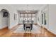 Formal dining room featuring hardwood floors and large windows with woven shades at 1157 Alta Ne Ave, Atlanta, GA 30307