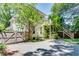 Back of the house showcasing a deck with steps leading down to a paved area next to an artificial grass lawn at 1157 Alta Ne Ave, Atlanta, GA 30307