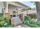 Inviting front porch with brick columns, ample seating area, and well-maintained landscaping at 1157 Alta Ne Ave, Atlanta, GA 30307