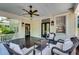 Relaxing front porch features comfortable seating, ceiling fan, and stylish decor at 1157 Alta Ne Ave, Atlanta, GA 30307