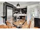 Kitchen boasting black cabinetry, stainless steel appliances, and hardwood floors at 1157 Alta Ne Ave, Atlanta, GA 30307