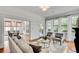 Bright living room with hardwood floors, large windows, and a view into the dining room at 1157 Alta Ne Ave, Atlanta, GA 30307