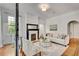 Bright living room with hardwood floors, fireplace, and elegant furnishings at 1157 Alta Ne Ave, Atlanta, GA 30307