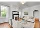 Bright living room with large window, fireplace, and cozy seating area at 1157 Alta Ne Ave, Atlanta, GA 30307