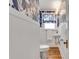 Stylish powder room featuring blue wallpaper, and wainscoting at 1157 Alta Ne Ave, Atlanta, GA 30307