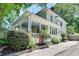 Charming two-story home featuring a welcoming front porch with a driveway on the side at 1157 Alta Ne Ave, Atlanta, GA 30307