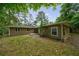 Cozy single-story home with neutral siding and a secluded, tree-lined backyard at 1304 Anchor Sw Ter, Atlanta, GA 30311