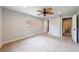 Large bedroom with ceiling fan, plush carpet, and bright natural light at 1304 Anchor Sw Ter, Atlanta, GA 30311
