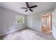 Comfortable bedroom with ceiling fan, closet, and natural light from large window at 1304 Anchor Sw Ter, Atlanta, GA 30311