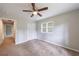 Comfortable bedroom with ceiling fan, closet, and natural light from large window at 1304 Anchor Sw Ter, Atlanta, GA 30311