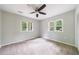 Bright bedroom features ceiling fan and natural light from dual windows at 1304 Anchor Sw Ter, Atlanta, GA 30311
