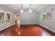 Bright dining room features hardwood floors, modern lighting, and large windows at 1304 Anchor Sw Ter, Atlanta, GA 30311