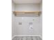 Laundry room with unfinished hook ups and one shelf at 1304 Anchor Sw Ter, Atlanta, GA 30311