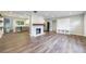 Spacious living area featuring wood floors, a stone fireplace, and a convenient entryway with storage at 1304 Anchor Sw Ter, Atlanta, GA 30311