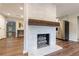 Elegant living space showcasing a stone fireplace, wood floors, and an open layout leading to other rooms at 1304 Anchor Sw Ter, Atlanta, GA 30311