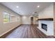Bright living room featuring wood floors, recessed lighting, and a cozy fireplace at 1304 Anchor Sw Ter, Atlanta, GA 30311