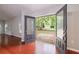 Open living room with access to backyard featuring wood floors and neutral colors at 1304 Anchor Sw Ter, Atlanta, GA 30311