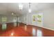 Large living room with wood floors and outdoor access via glass doors at 1304 Anchor Sw Ter, Atlanta, GA 30311