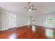 Bright living room with hardwood floors, large windows, and neutral colored walls at 1304 Anchor Sw Ter, Atlanta, GA 30311