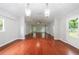 Spacious living room featuring hardwood floors, neutral colors and access to the outdoors at 1304 Anchor Sw Ter, Atlanta, GA 30311