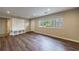 Bright living room boasting wood floors, recessed lights, and convenient built-in storage by the entry at 1304 Anchor Sw Ter, Atlanta, GA 30311