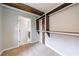 Walk-in closet with custom shelving and a glimpse into the attached bathroom at 1304 Anchor Sw Ter, Atlanta, GA 30311