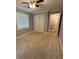 Bedroom offers carpet flooring, neutral paint, closet with folding doors, and plenty of natural light from windows at 25 Stonehedge Dr, Buford, GA 30518