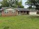 Charming one-story brick home with a well-maintained lawn and attached garage at 25 Stonehedge Dr, Buford, GA 30518