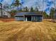 The back of the home shows a large backyard and well-maintained landscaping at 5295 Greenway Dr, Villa Rica, GA 30180