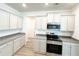 Well-equipped kitchen featuring stainless steel appliances and granite countertops with ample storage at 5295 Greenway Dr, Villa Rica, GA 30180