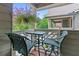 Inviting balcony with green furniture and hanging flower baskets, providing a relaxing outdoor atmosphere at 690 Mcgill Ne Pl, Atlanta, GA 30312