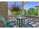 Outdoor balcony with chairs, table, and hanging flower baskets offer a pleasant outdoor living space at 690 Mcgill Ne Pl, Atlanta, GA 30312