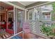 Cozy balcony with chair, red-trimmed door, and view of living area, perfect for relaxing outdoors at 690 Mcgill Ne Pl, Atlanta, GA 30312