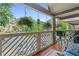 Relaxing balcony features hanging flower baskets, outdoor seating, and views of well-maintained parking area at 690 Mcgill Ne Pl, Atlanta, GA 30312