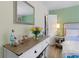 Cozy bedroom showcases a well-lit dresser, complements the room's calming color palette, and accents the space at 690 Mcgill Ne Pl, Atlanta, GA 30312