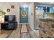 Hallway with modern flooring, accent wall, and view to the kitchen at 690 Mcgill Ne Pl, Atlanta, GA 30312