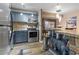 Stylish kitchen featuring stainless steel appliances and breakfast bar at 690 Mcgill Ne Pl, Atlanta, GA 30312