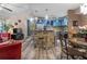 The living space has blue kitchen accents and a stone island, seamlessly connecting cooking and dining areas at 690 Mcgill Ne Pl, Atlanta, GA 30312