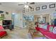 Bright living space with an open layout and stylish red sofa, leading to the kitchen and dining areas at 690 Mcgill Ne Pl, Atlanta, GA 30312