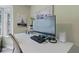 This office space features a sleek monitor and contemporary desk setup, blending productivity with modern design at 690 Mcgill Ne Pl, Atlanta, GA 30312