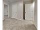 Bedroom featuring neutral walls, carpet, and doors leading to other rooms at 943 Colvin Dr, Locust Grove, GA 30248