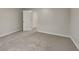 Bedroom featuring neutral walls, carpet, and doors leading to other rooms at 943 Colvin Dr, Locust Grove, GA 30248
