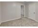 Bedroom featuring neutral walls, carpet, and doors leading to another room at 943 Colvin Dr, Locust Grove, GA 30248