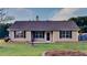 Charming single-story home with a well-maintained lawn, classic shutters, and neutral siding at 943 Colvin Dr, Locust Grove, GA 30248