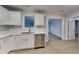 Well-lit kitchen featuring stainless steel appliances, white countertops, and ample counter space at 943 Colvin Dr, Locust Grove, GA 30248