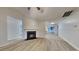Cozy living room with modern floors and a classic fireplace at 943 Colvin Dr, Locust Grove, GA 30248